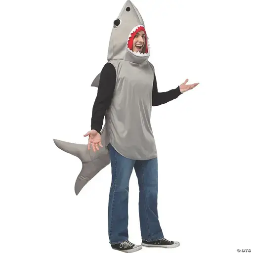 A man in an adult-sized shark costume making a "tada!" gesture with his hands.